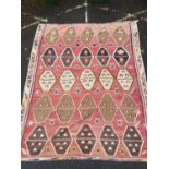 An antique red, cream, yellow and brown kelim rug, 340cm x 270cmCondition report: Some wear and