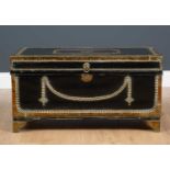 An early 19th century studded brass and leather bound camphor wood trunk with brass carrying handles