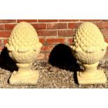 A pair of cast reconstituted stone pineapple gate post finials 30cm wide x 50cm highCondition