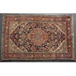 An early to mid 20th century Middle Eastern red and blue ground rug 196cm x 124cm and a larger