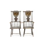 A pair of possibly George III Scottish grey painted Windsor armchairs, the shield shaped splats