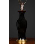 A late 19th century black glazed porcelain vase converted to a table lamp with gilt mounts, 37cm