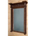 A 19th century neoclassical French dressing mirror, with bevelled oak and architectural carved