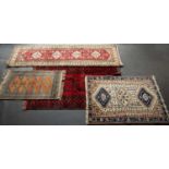 Four Eastern rugs: 150cm x 104cm; 200cm x 112cm; 128cm x 76cm and 275cm x 81cmCondition report: Some