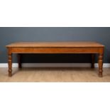 An oak large rectangular table with deep frieze and turned tapering legs, 245cm long x 105cm wide