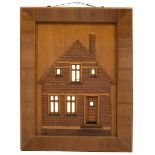A 20th century Continental relief model of a house facade in contrasting woods with parquetry walls,