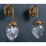 A pair of Jim Lawrence wall lights with cut glass shades, approximately 32cm high overall together