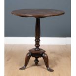 A George III country made mahogany circular tilt top occasional table with octagonal column