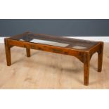 An antique French cherrywood baby walker of rectangular form with slotted supports, all standing