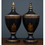 A pair of black painted parcel gilt ceramic table lamps in the form of classical vases, each 23cm