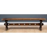 A Victorian oak bench with shaped end supports and trefoil punched stretcher, 153cm long x 30cm deep