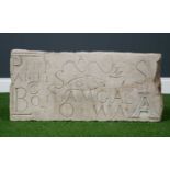 A Masons limestone practice block inscribed with a fish and various letters, 63cm x 28cmCondition