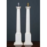 A pair of contemporary white painted table lamps of column form, each approximately 66cm