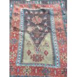 An antique Kelim red and blue ground prayer mat 159cm x 120cm and a further antique flat weave rug