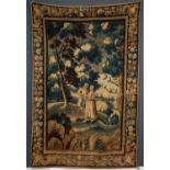 A continental 18th century tapestry depicting two lovers walking beneath trees, all set within a