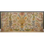 A large crewel work panel on a gilt slip frame, the brightly coloured central floral spray