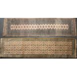 Two mid to late 20th century Eastern woollen runners each with geometric decoration, 296cm x 77cm