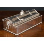 A 19th century silver plated casket form desk stand, containing two cut glass and silver plated