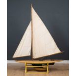 A large Edwardian pond yacht on stand, 'Rosemary', with adjustable sails and articulated rudder on a