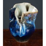 An abstract form baluster clay vase with blue-green rustic glaze, stamped to the base Terre du Berry