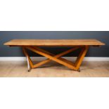 A contemporary oak dining table, the six plank top on oak and steel asymmetric cross brace, sold