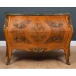 A marble topped bombe shaped commode with gilt metal mounts and fittings and figured walnut inset