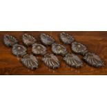 A set of four early 19th century bronze mounts, the acanthus leaf shaped ends flanking central