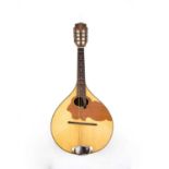 An East German mandolin, the back with parquetry decoration and with shaped inset panel to the