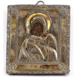 An antique Russian icon painted with The Virgin Mary and Child, with silver gilt okale, 16.5 x 15cm