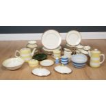 A collection of blue and white, and yellow and white Cornish wear including a teapot, coffee pot,