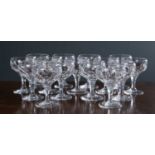 A group of fifteen Webb style glass royal yacht champagne coupes with faceted bowls and stems and