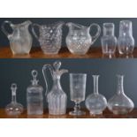 A collection of antique and later glassware, to include decanters, jugs and vases, the largest