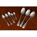 A collection of silver cutlery, comprising; three fiddle pattern tablespoons, two Exeter 1834 and