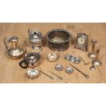 A quantity of silver plated wares to include two teapots and a coffee pot together with an oak