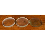 Three clear glass lenses; two concave, 23cm diameter x 3cm deep and one convex, 23cm diameter x