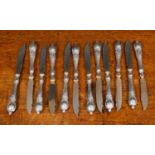 A set of twelve 19th century continental fruit knives with white metal handles, each 16.5cm in