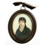 A late 18th / early 19th century portrait miniature depicting a gentleman painted on ivory, 7cm x