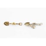 Two 19th century prospectors' bar brooches, each modelled as a shovel with wirework rope and