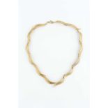 A 9ct gold collar necklace, designed as a series of repeating leaf panels, maker's mark EFC,