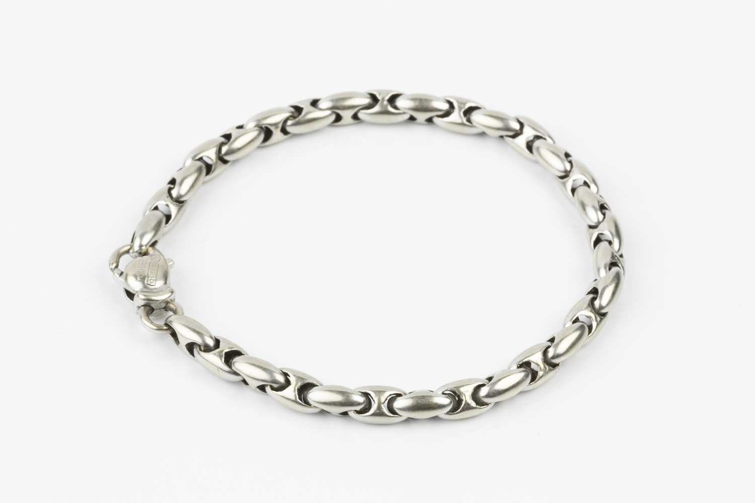 A white precious metal fancy-link bracelet, designed as a series of repeating ovoid links, - Image 2 of 2