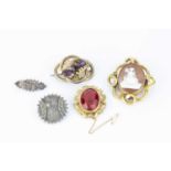 A collection of Victorian and later brooches, comprising an oval shell cameo brooch, carved to