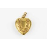 A late Victorian 15ct gold heart pendant, applied with a wreath of flowerheads and foliage,