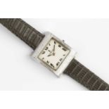 A lady's 'Buckingham' wristwatch by Corum, the square silvered dial with black Roman numerals, to
