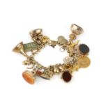 A charm bracelet, the 18ct gold curb-link bracelet suspending a collection of antique and later