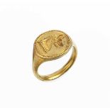 An antique gold signet ring, the oval panel incised with dog's head crest, ring size approximately