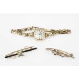 A lady's 9ct gold bracelet watch by Rotary, the cushion-shaped silvered dial with baton markers,