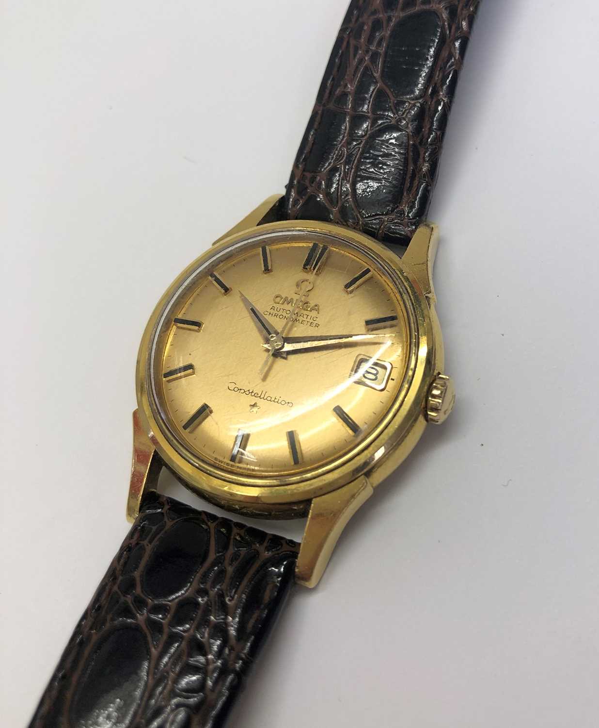 A 'Constellation' automatic wristwatch by Omega, the circular gilt dial with black baton markers, - Image 7 of 12