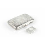 A late Victorian silver rectangular small box, of shaped outline, engraved with scrolling foliage,