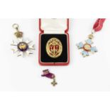 A collection of medals, comprising an enamel Order of St. Michael & St. George, a George V OBE, with