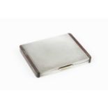 An Art Deco silver cigarette case, by Alfred Dunhill & Sons, of reeded rectangular form edged with a